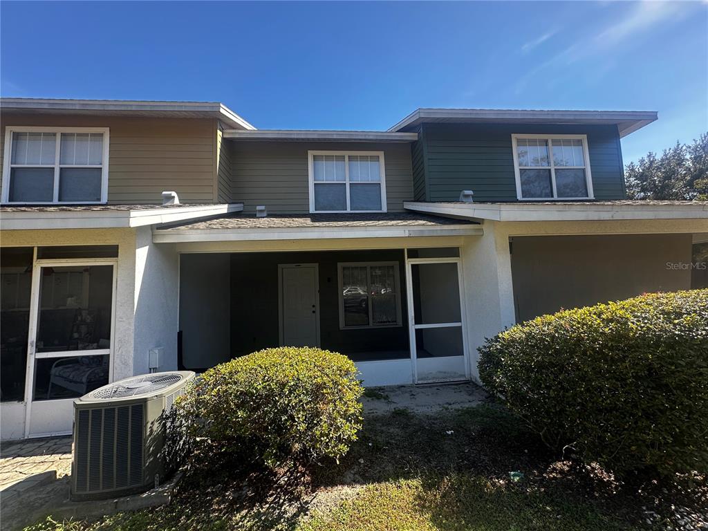 2348 Southwest 42nd Drive, Unit 153 Gainesville, FL 32607 - Photo 6 of 18 a front view of a house with a yard