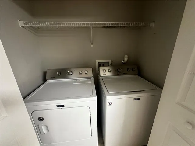 a utility room with dryer and washer