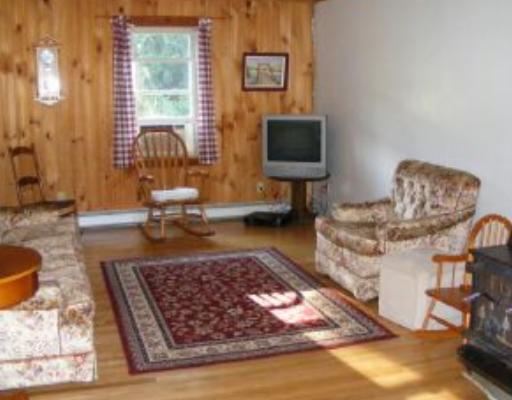 201 Rocks Road Parker, PA 16049 - Photo 9 of 15 Living Room. Note woodburner on right