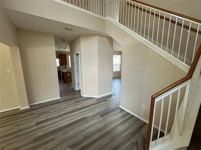 a view of entryway with wooden floor