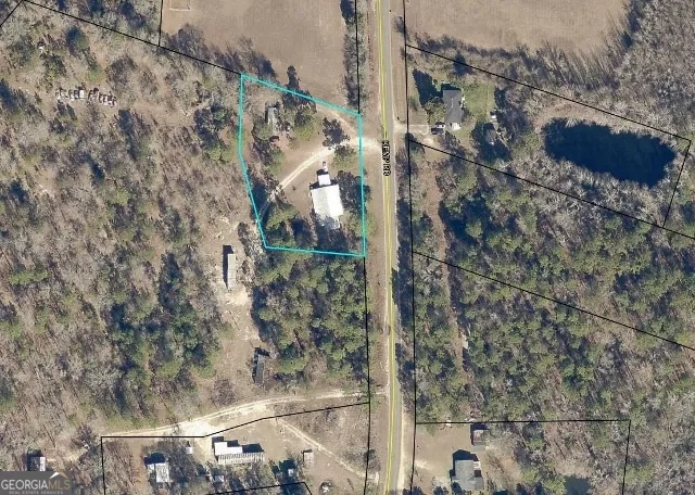 a aerial view of a house with a yard