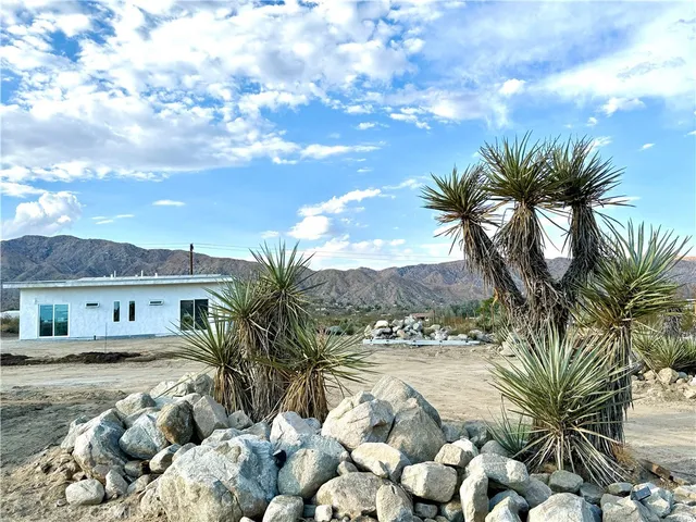 a view of pool with yard