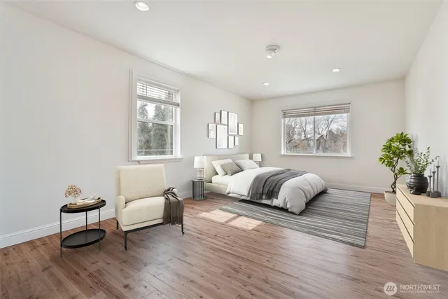 a bedroom with bed and a chandelier