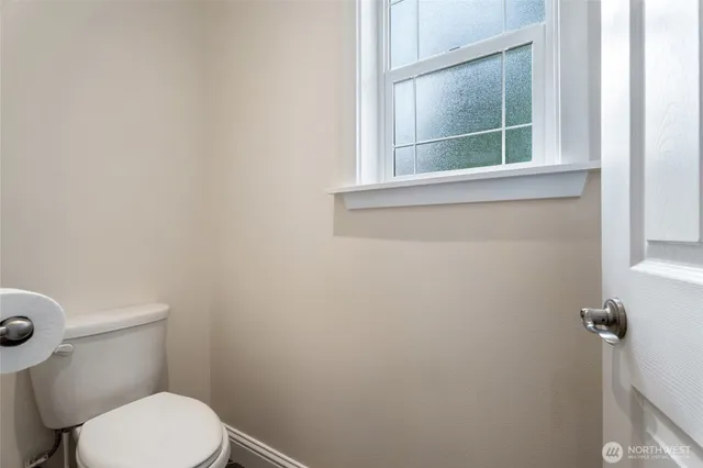 a bathroom with a granite countertop sink mirror toilet and bathtub