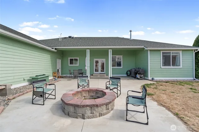 a view of living room with patio and fireplace