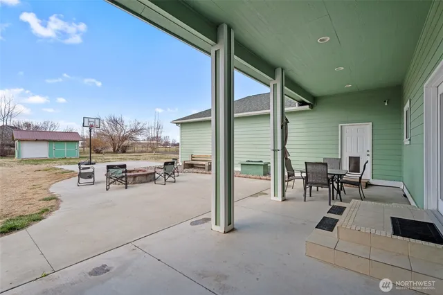 a front view of a house with a garden and deck