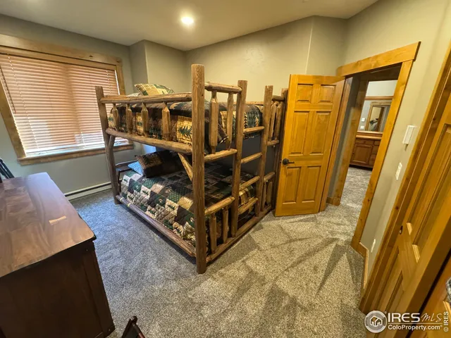 a bed room with a bed and a window