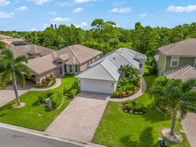 a aerial view of a house with garden space and street view