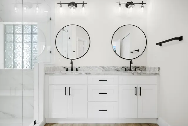 a bathroom with a sink and a mirror