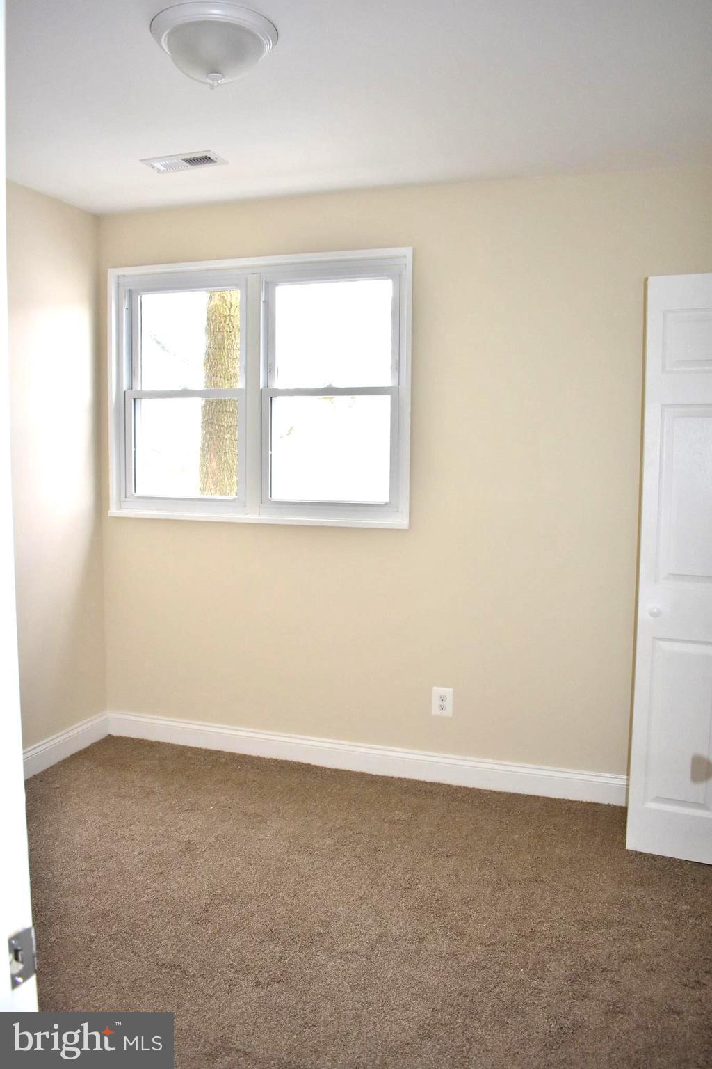 7733 Oxman Road Landover, MD 20785 - Photo 11 of 19 an empty room with a window