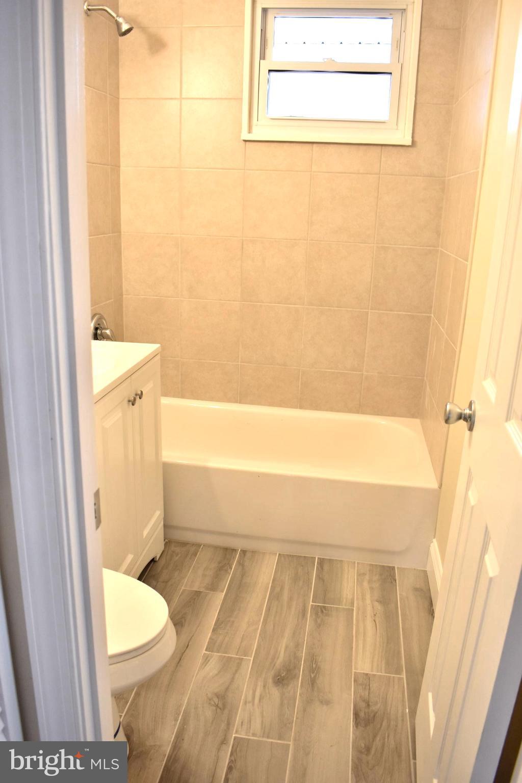 7733 Oxman Road Landover, MD 20785 - Photo 16 of 19 a bathroom with a toilet and a shower