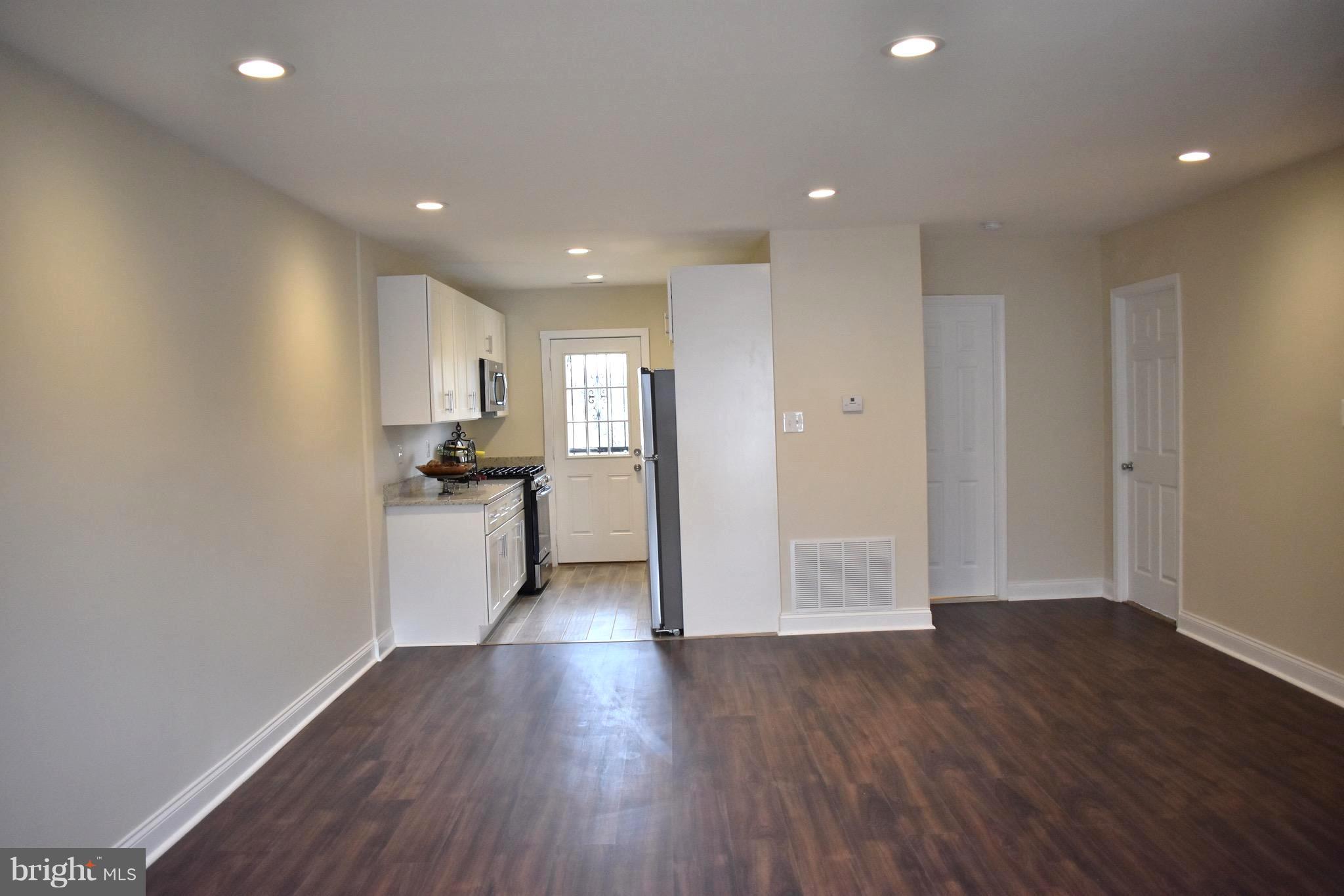 7733 Oxman Road Landover, MD 20785 - Photo 5 of 19 a view of a kitchen with wooden floor