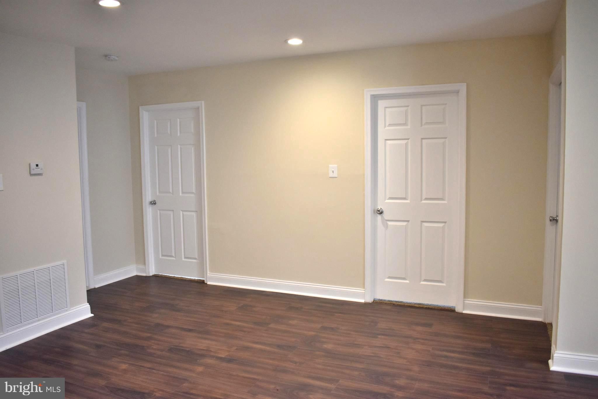 7733 Oxman Road Landover, MD 20785 - Photo 6 of 19 a view of empty room with wooden floor