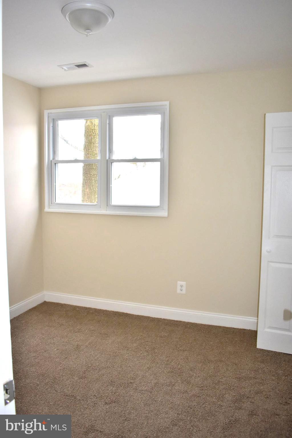 7733 Oxman Road Landover, MD 20785 - Photo 9 of 19 an empty room with a window