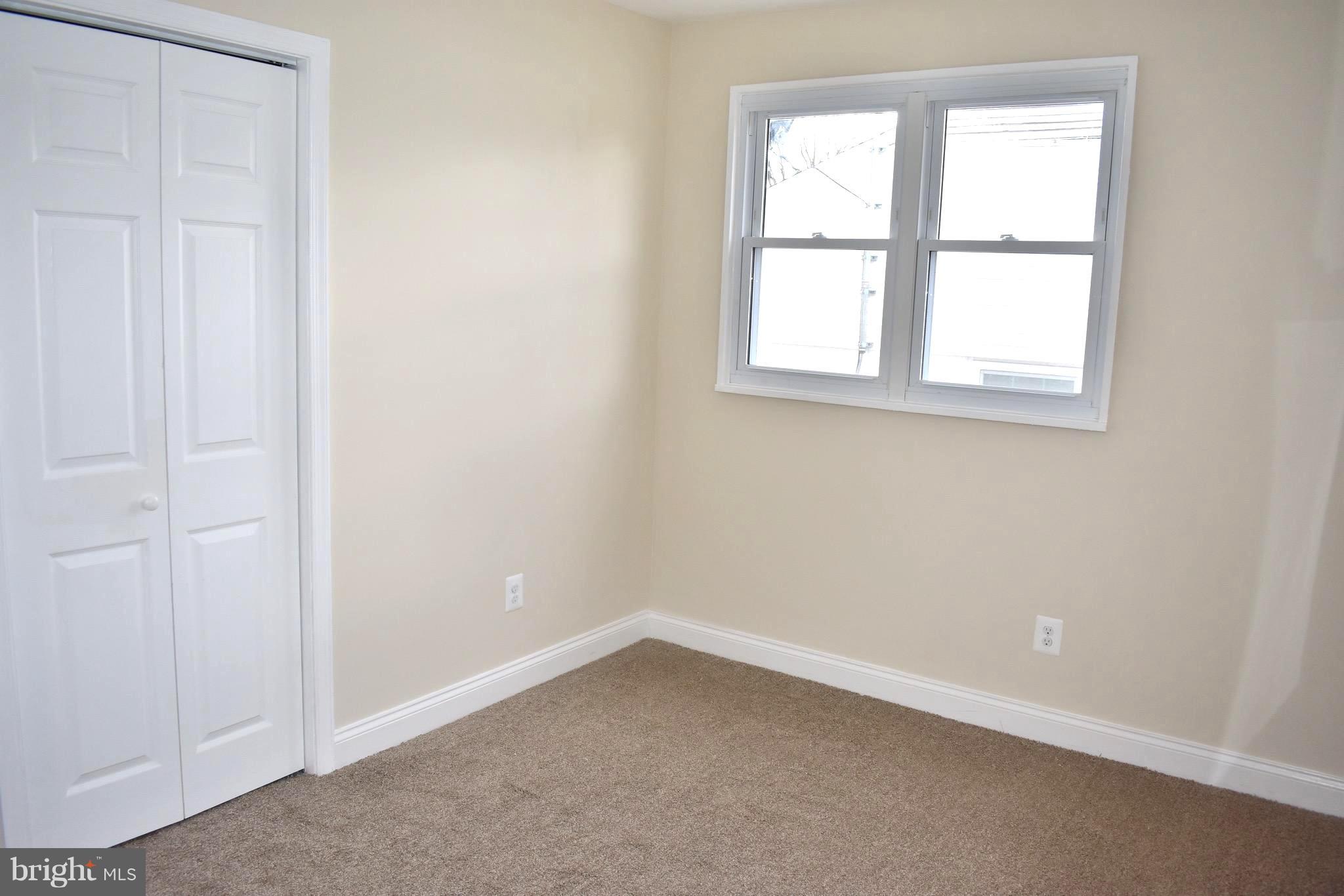 7733 Oxman Road Landover, MD 20785 - Photo 10 of 19 an empty room with a window