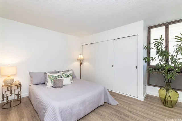 a bedroom with a bed and a table