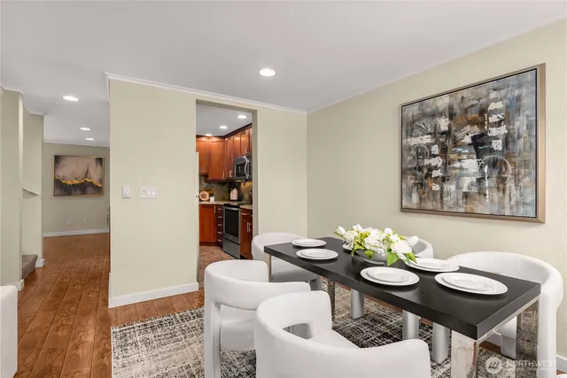 a view of a dining room with furniture and wooden floor