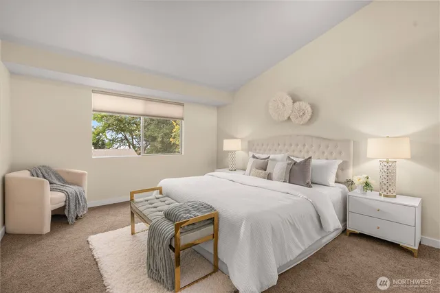 a bedroom with a bed and a chair