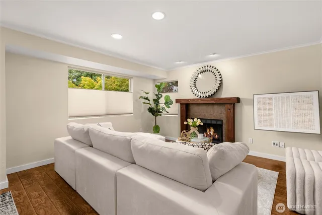 a living room with furniture a fireplace and a table