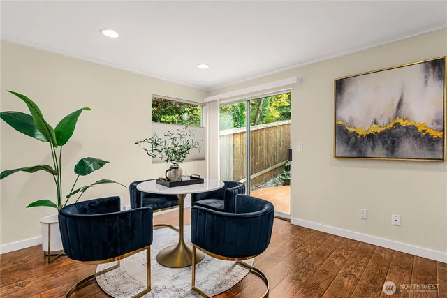 a living room with furniture and potted plant