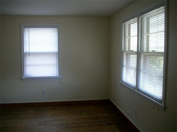190 East Street Springfield, MA 01104 - Photo 4 of 5 a view of an empty room with wooden floor and a window