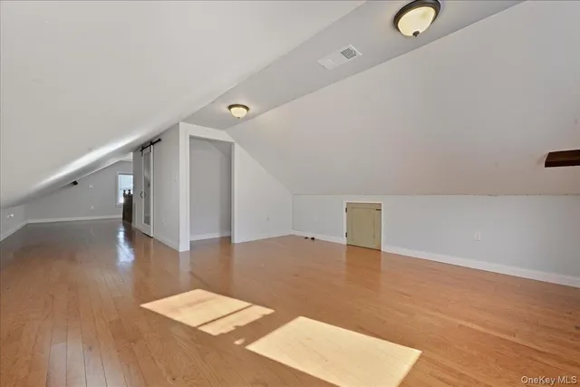a view of a hallway with stairs