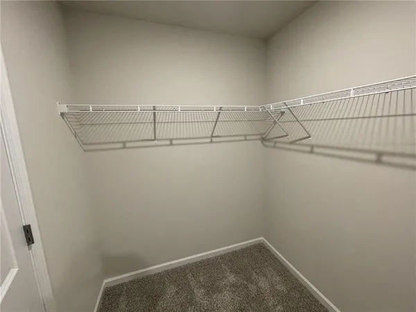 a view of a room with racks on the wall