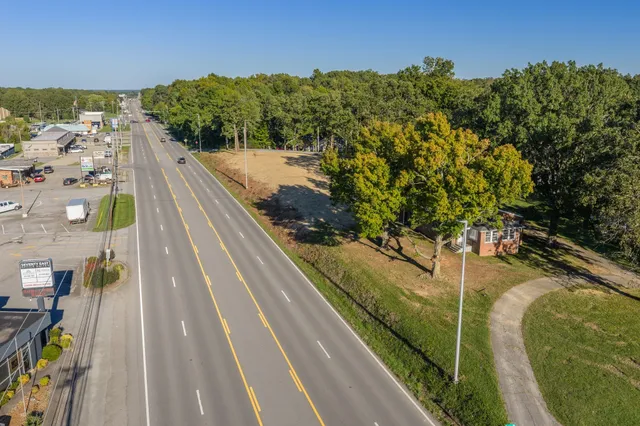a view of balcony with yard