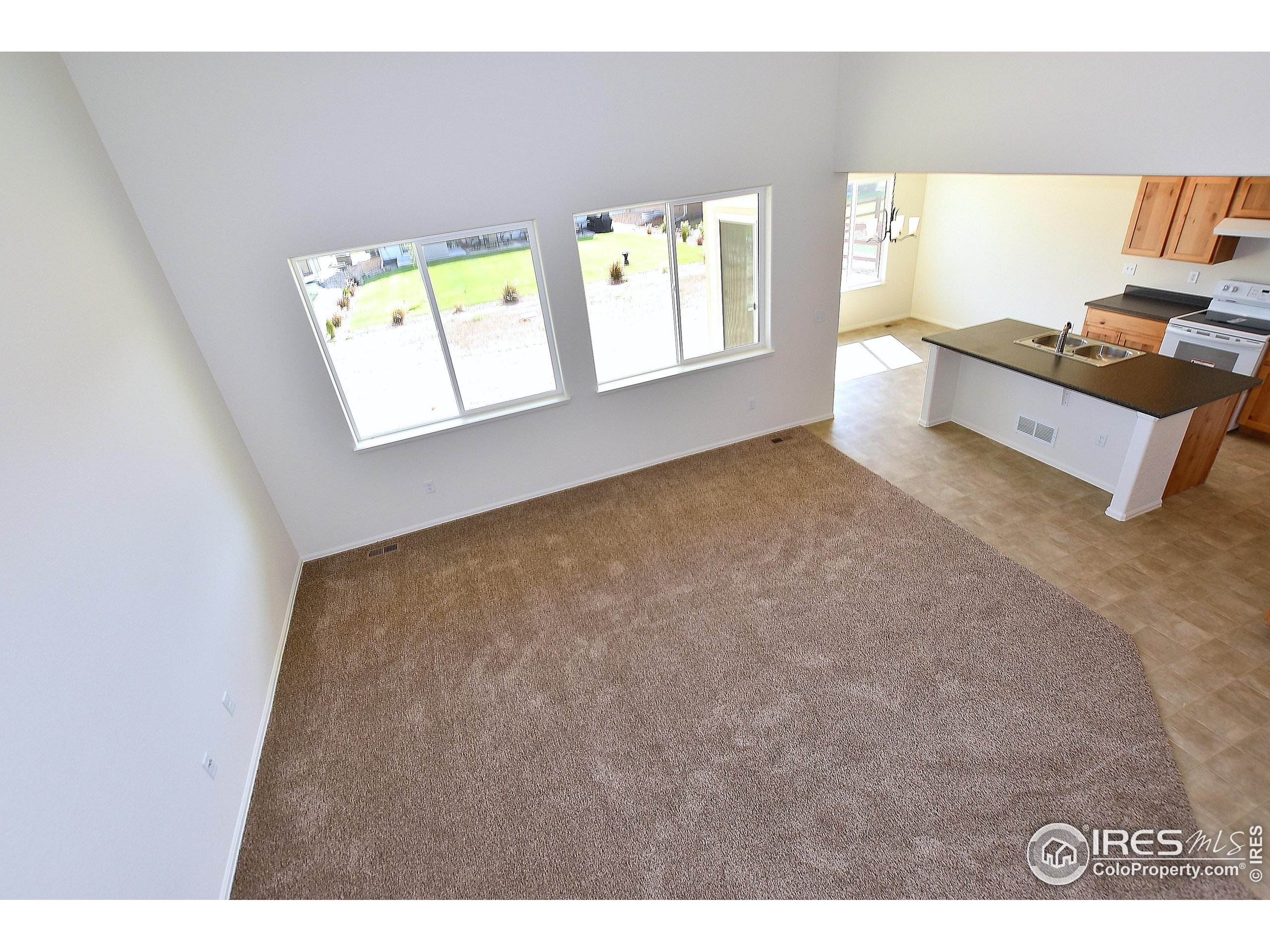 620 87th Avenue Greeley, CO 80634 - Photo 13 of 39 a view of an empty room with a window