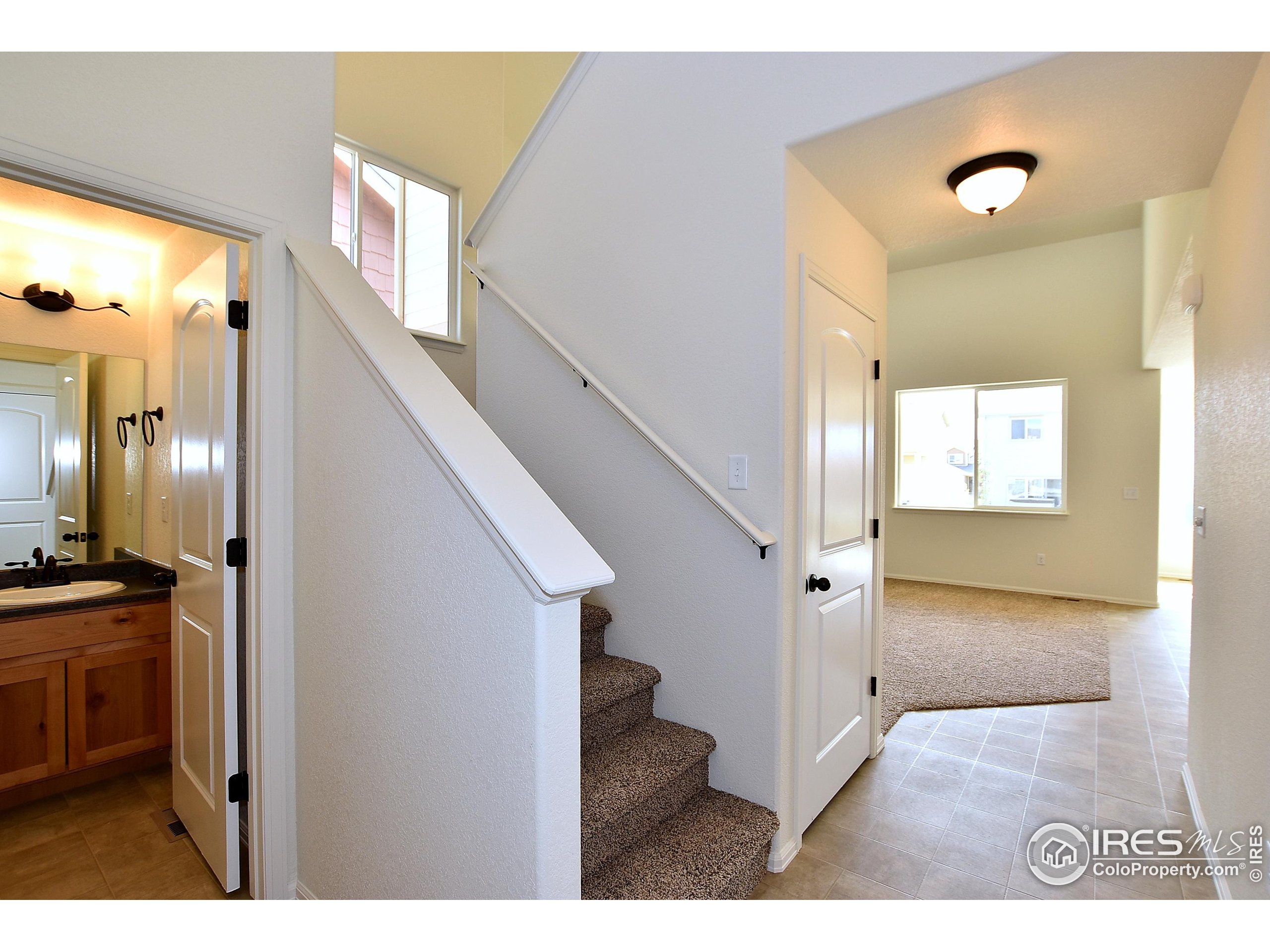 620 87th Avenue Greeley, CO 80634 - Photo 21 of 39 a view of an entryway with wooden floor