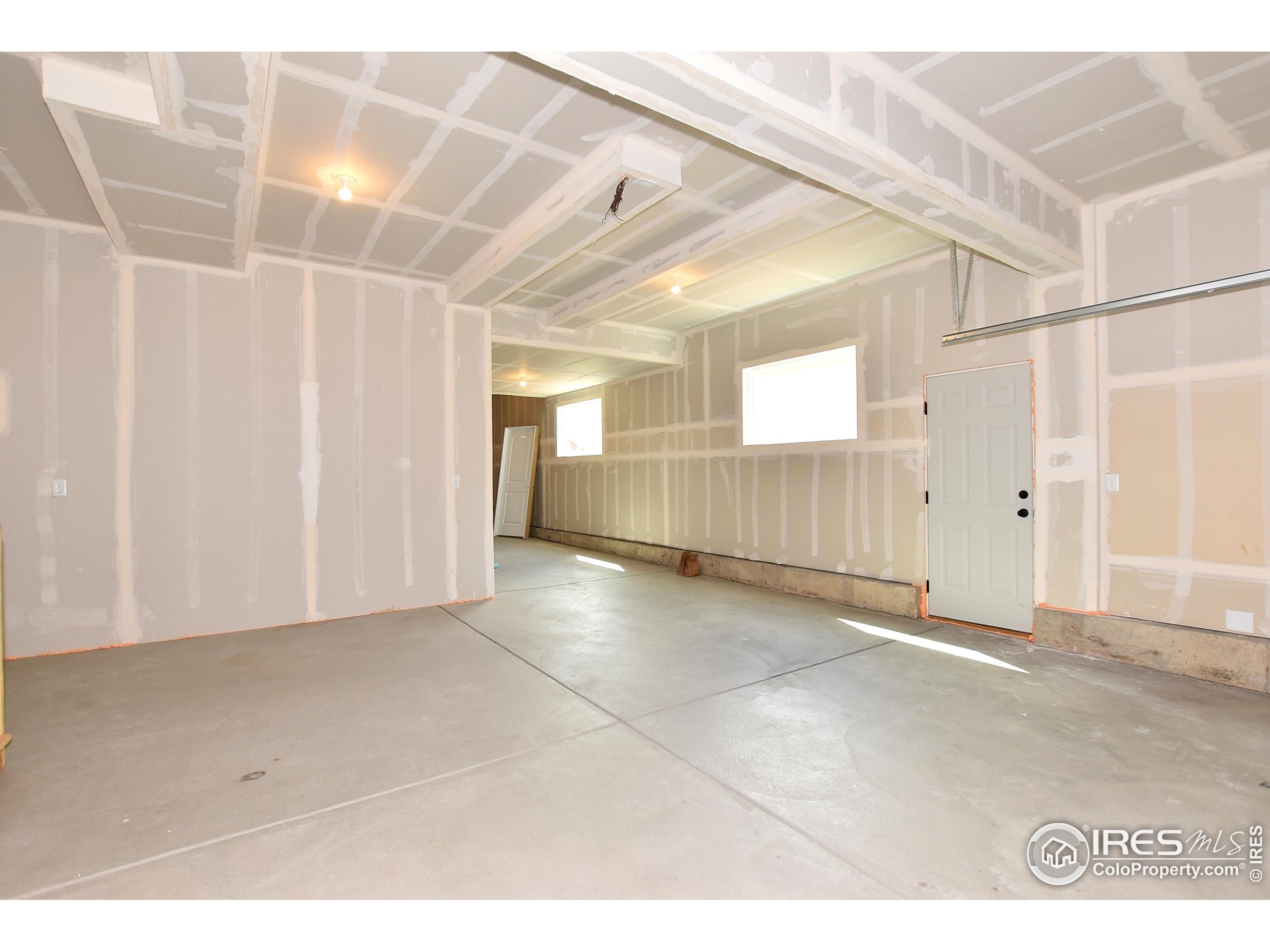 620 87th Avenue Greeley, CO 80634 - Photo 37 of 39 a view of a hallway with wooden floor