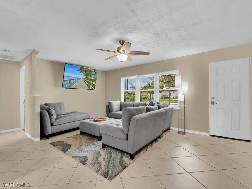 26499 Eager Road Punta Gorda, FL 33955 - Photo 12 of 21 a living room with furniture and a large window