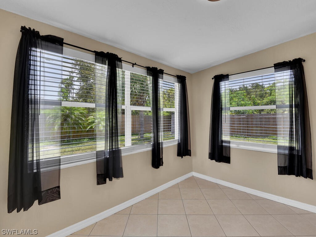 26499 Eager Road Punta Gorda, FL 33955 - Photo 17 of 21 a view of an empty room with windows
