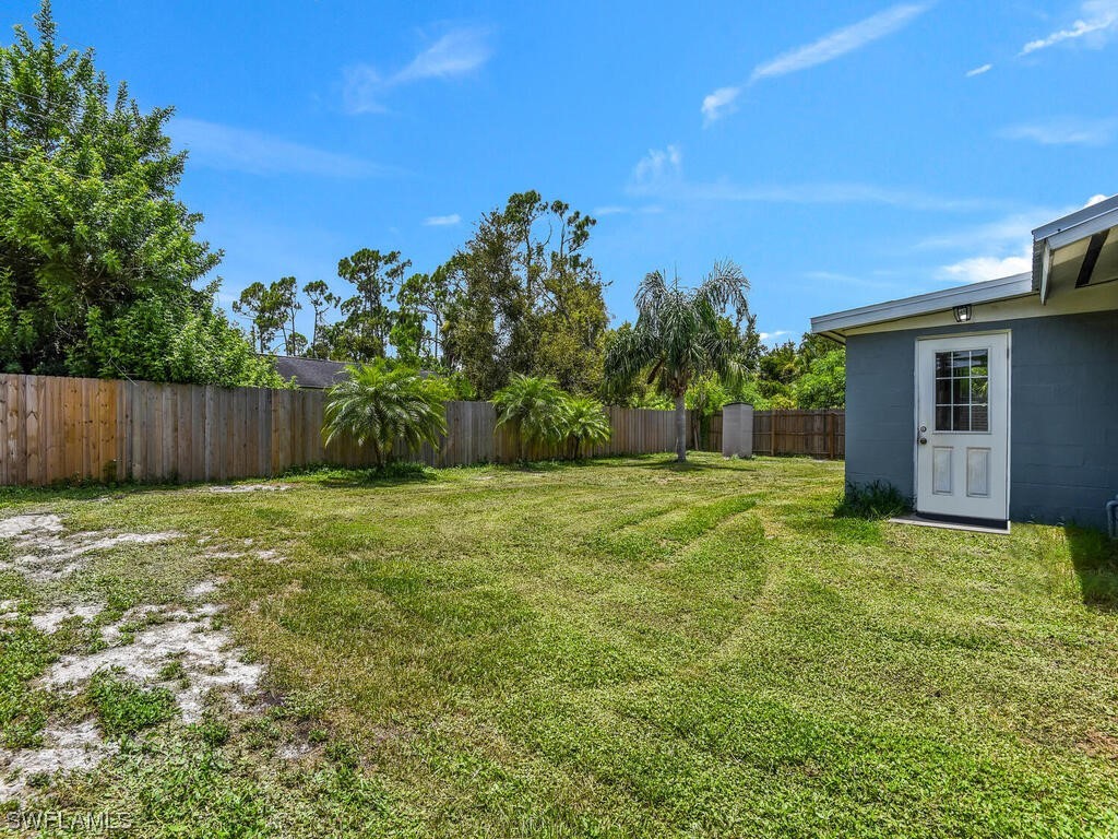 26499 Eager Road Punta Gorda, FL 33955 - Photo 20 of 21 a backyard of a house with lots of green space