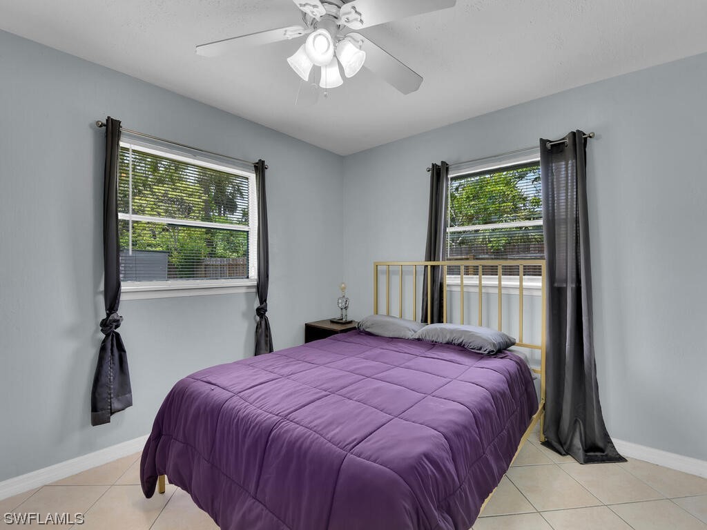 26499 Eager Road Punta Gorda, FL 33955 - Photo 5 of 21 a bedroom with a large bed and a window