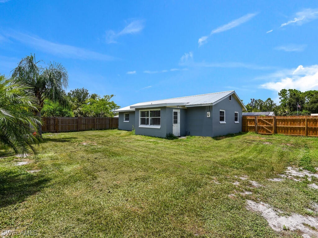 26499 Eager Road Punta Gorda, FL 33955 - Photo 9 of 21 a backyard of a house with lots of green space and garden