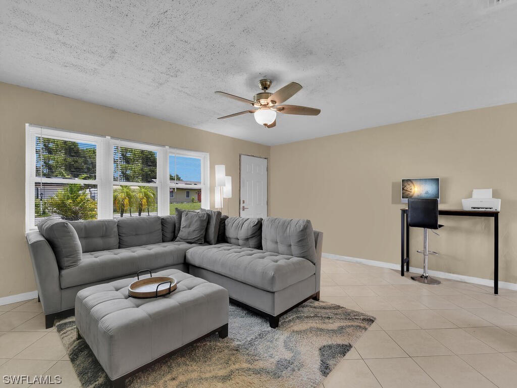 26499 Eager Road Punta Gorda, FL 33955 - Photo 10 of 21 a living room with furniture and a window