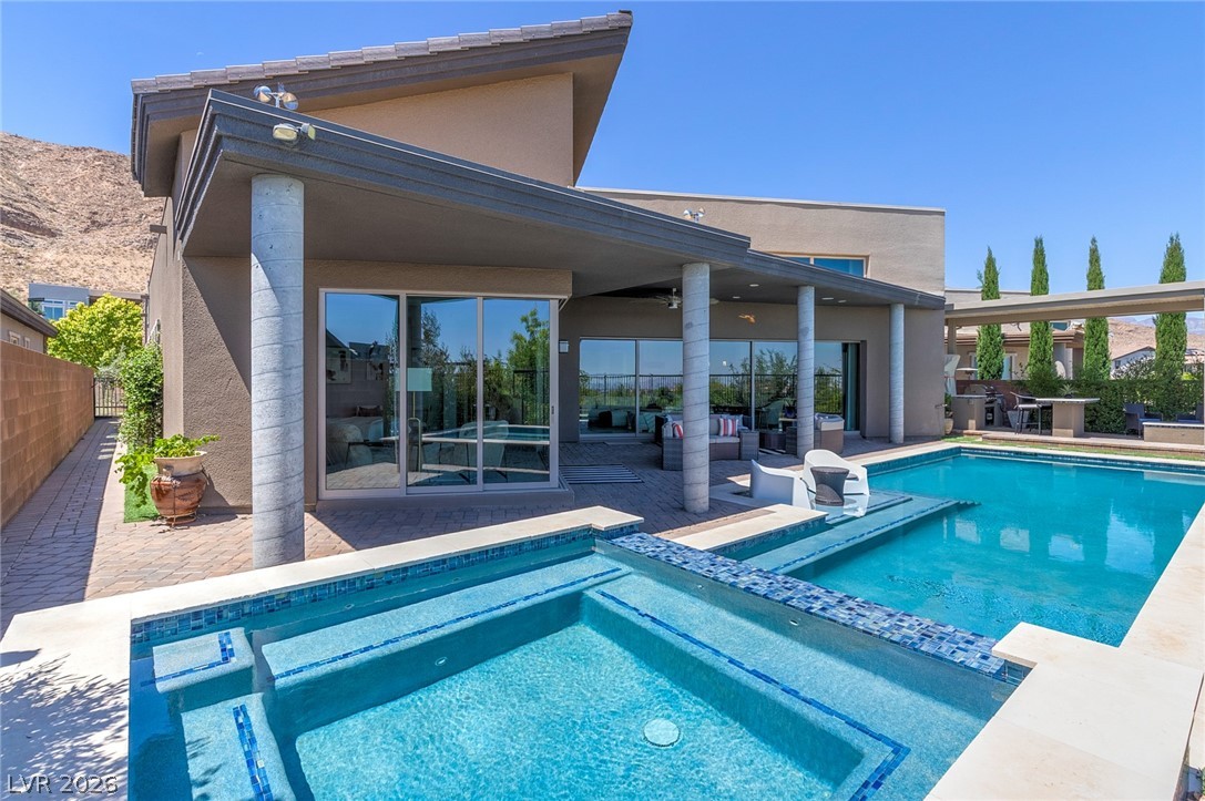 6014 Willow Ridge Court Las Vegas, NV 89135 - Photo 69 of 99 This exquisite home boasts a captivating pool and spa, perfect for outdoor relaxation and entertaining.