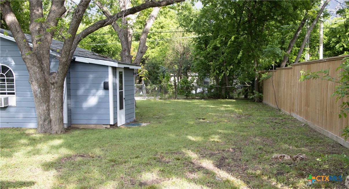 1407 South 7th Street Temple, TX 76504 - Photo 28 of 36 a view of a tree in front of a house with large trees