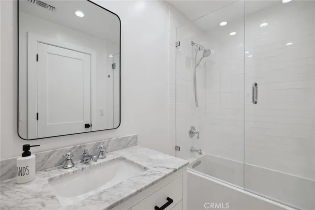 a view of a chair and tables the balcony