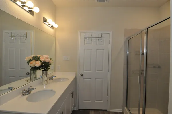 a bathroom with a sink toilet and a mirror