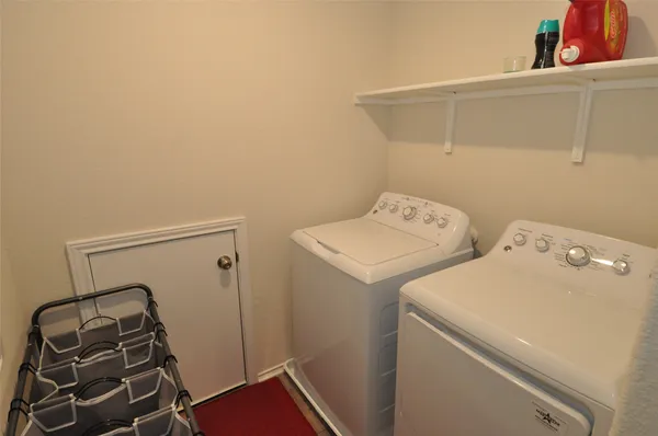 a bedroom with a bed and a chair