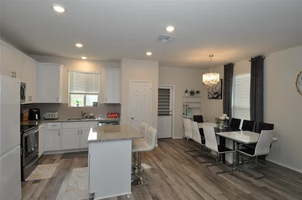 a large kitchen with lots of counter space and a sink