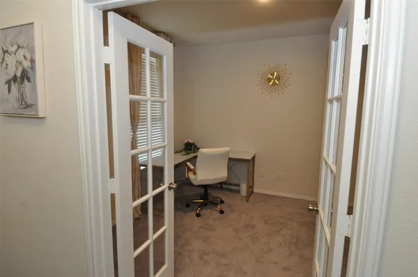 a kitchen with stainless steel appliances kitchen island granite countertop a sink and a stove