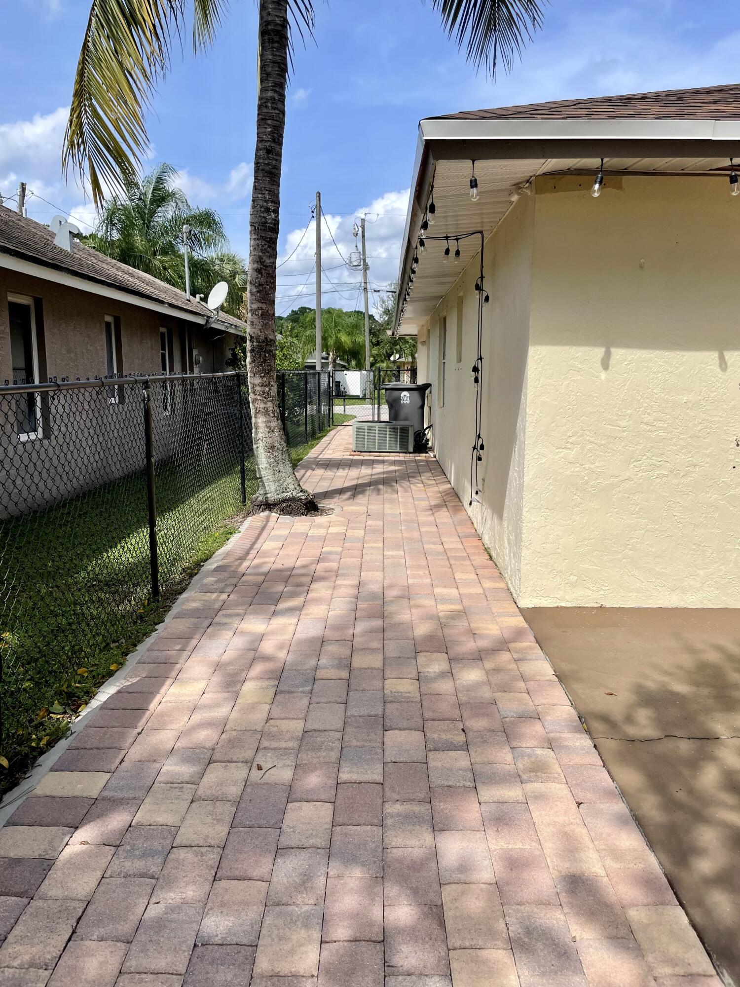 6644 4th Street Jupiter, FL 33458 - Photo 19 of 24 6644 SIDE PAVERS