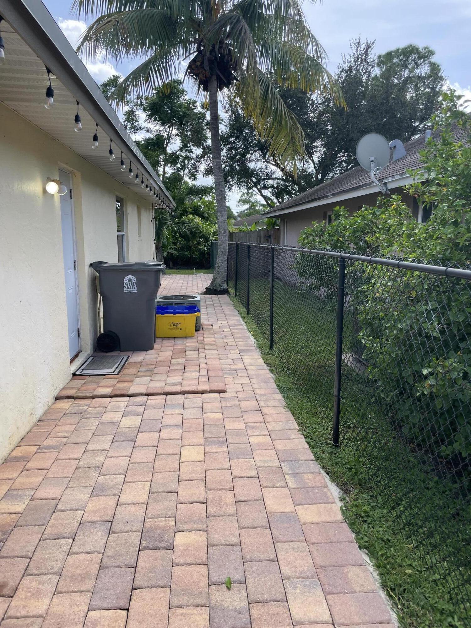 6644 4th Street Jupiter, FL 33458 - Photo 20 of 24 6644 SIDE PAVERS