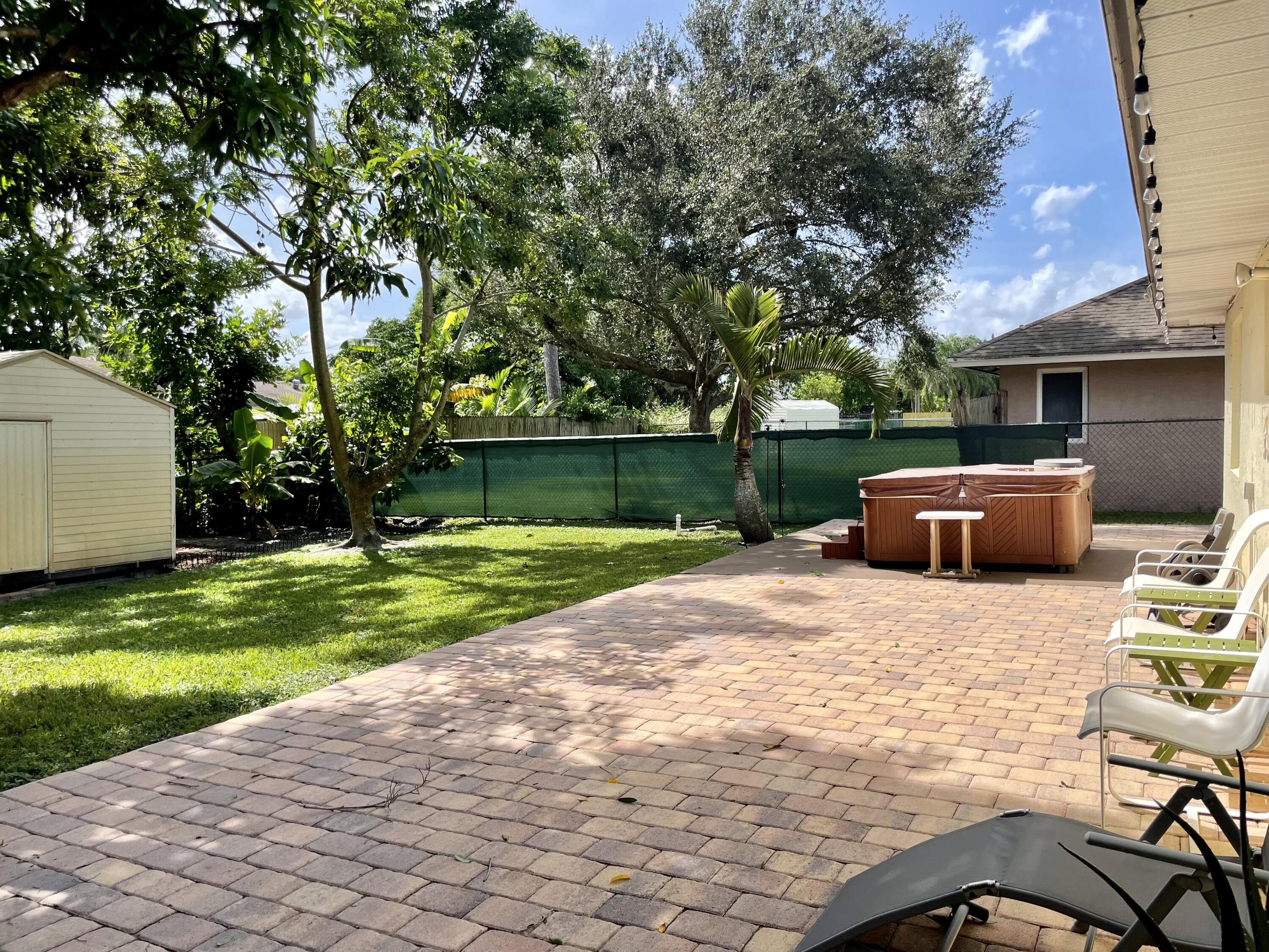 6644 4th Street Jupiter, FL 33458 - Photo 22 of 24 6644 BRICK PAVER PATIO