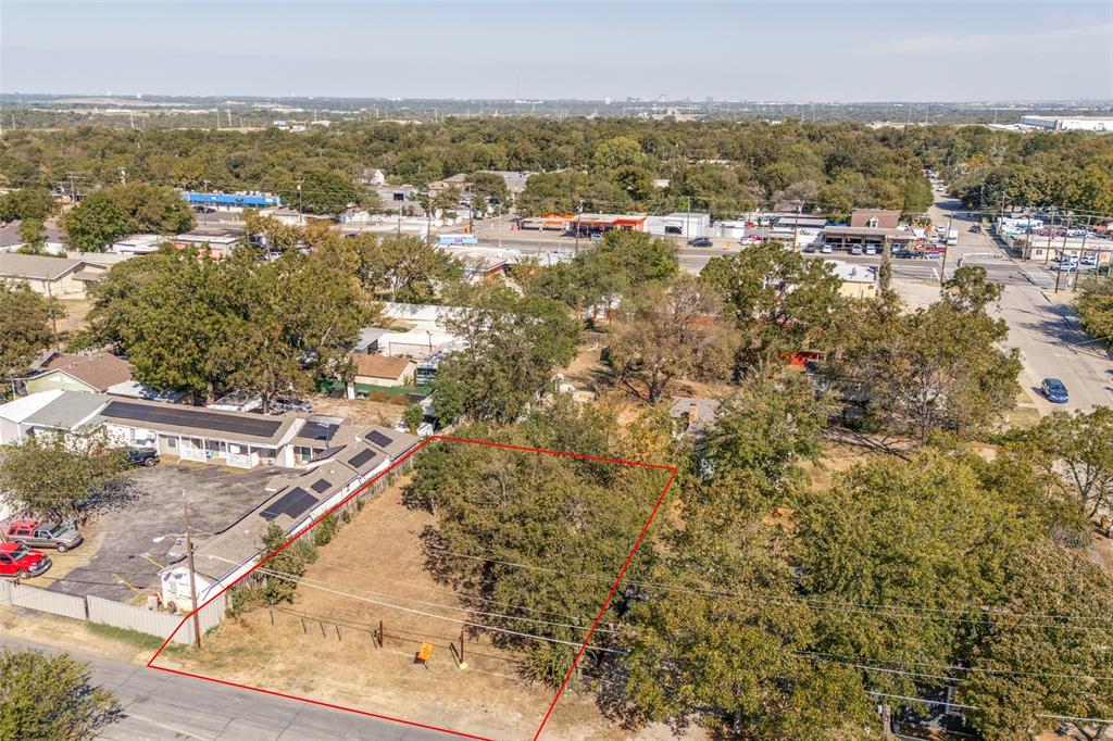 5115 Spruce Street Dallas, TX 75211 - Photo 1 of 10 View of property location featuring property parcel outlined and a tree filled landscape