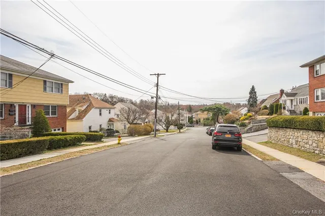 a view of street with parked cars