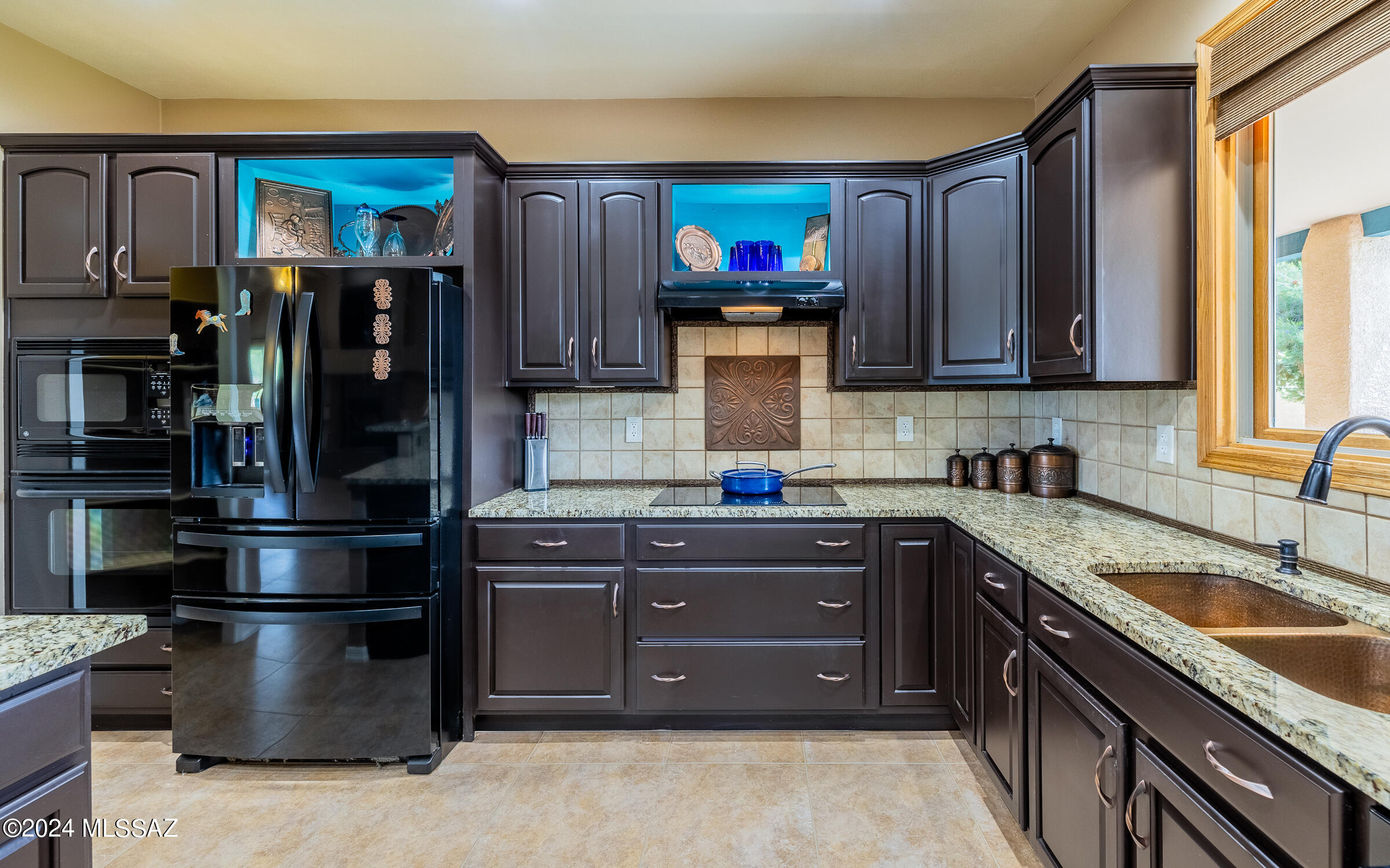 341 Sharon Road Vail, AZ 85641 - Photo 7 of 50 a kitchen with a sink and a refrigerator
